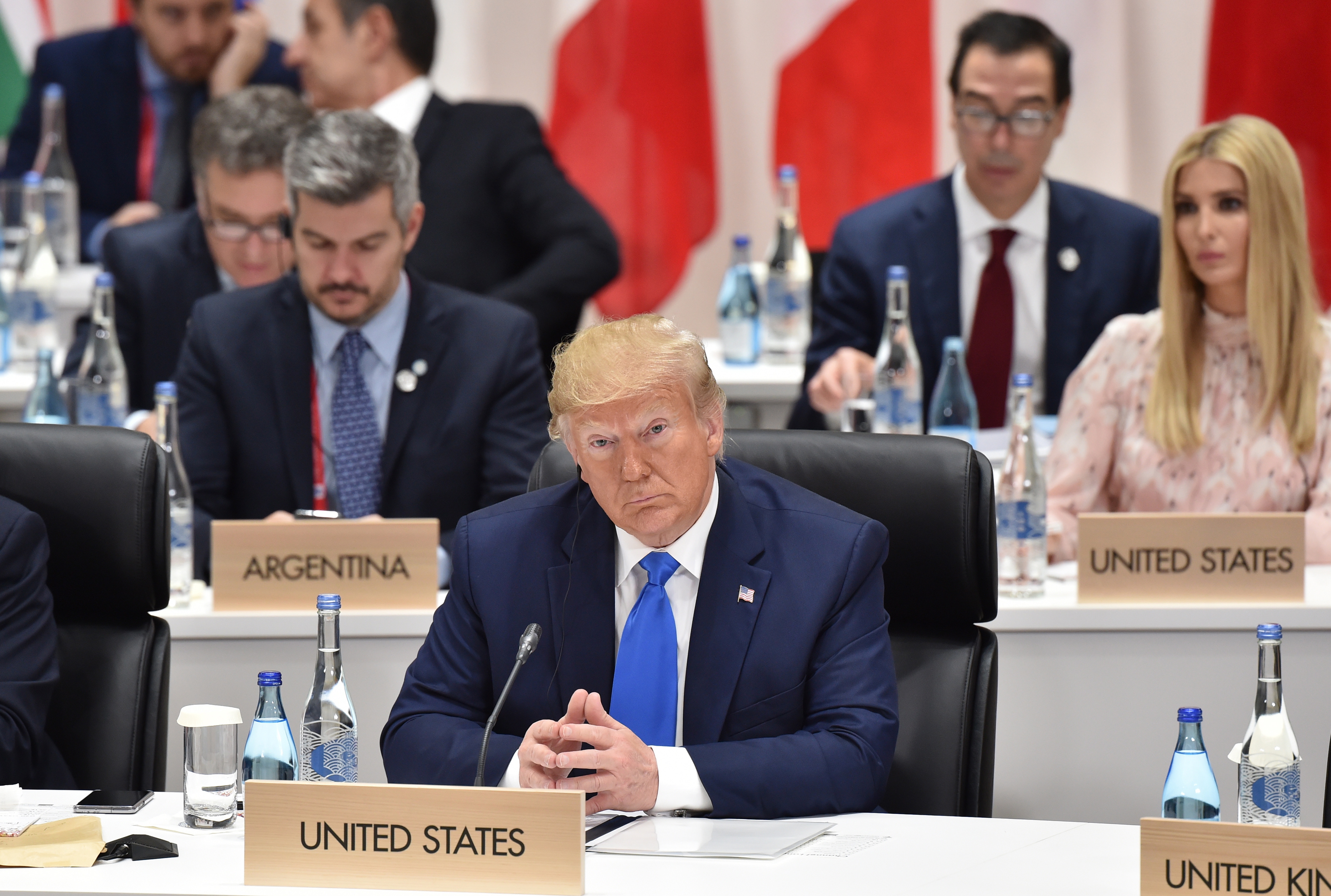 epa07681417 US President Donald Trump (R) attends the second day of the G20 summit in Osaka, Japan, 29 June 2019. It is the first time Japan will host a G20 summit. The summit gathers leaders from 19 countries and the European Union to discuss topics such as global economy, trade and investment, innovation and employment.  EPA/KAZUHIRO NOGI / POOL