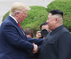 epa07683978 US President Donald J. Trump (L) with North Korean leader Kim Jong-un shake hands after crossing the Military Demarcation Line into the southern side of the truce village of Panmunjom in the Demilitarized Zone, which separates the two Koreas, 30 June 2019. The US leader arrived in South Korean on 29 June for a two-day visit that will include a meeting with South Korean President Moon Jae-in and a trip to the Demilitarized Zone.  EPA/YONHAP SOUTH KOREA OUT