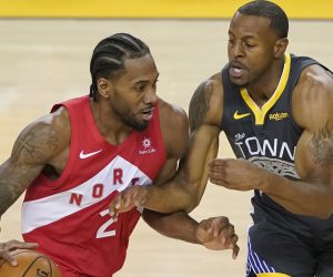 epa07646928 Toronto Raptors player Kawhi Leonard (L) drives against Golden State Warriors player Andre Iguodala (R) during the first half of the NBA Finals game six at Oracle Arena, in Oakland, California, USA, 13 June 2019.  EPA/JOHN G MABANGLO SHUTTERSTOCK OUT SHUTTERSTOCK OUT