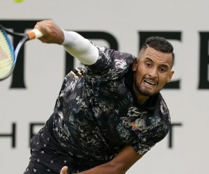 epa07660798 Australia's Nick Kyrgios serves to Spain's Roberto Carballes Baena during their round 32 match at the Fever Tree Championship at Queen's Club in London, Britain, 20 June 2019.  EPA/WILL OLIVER
