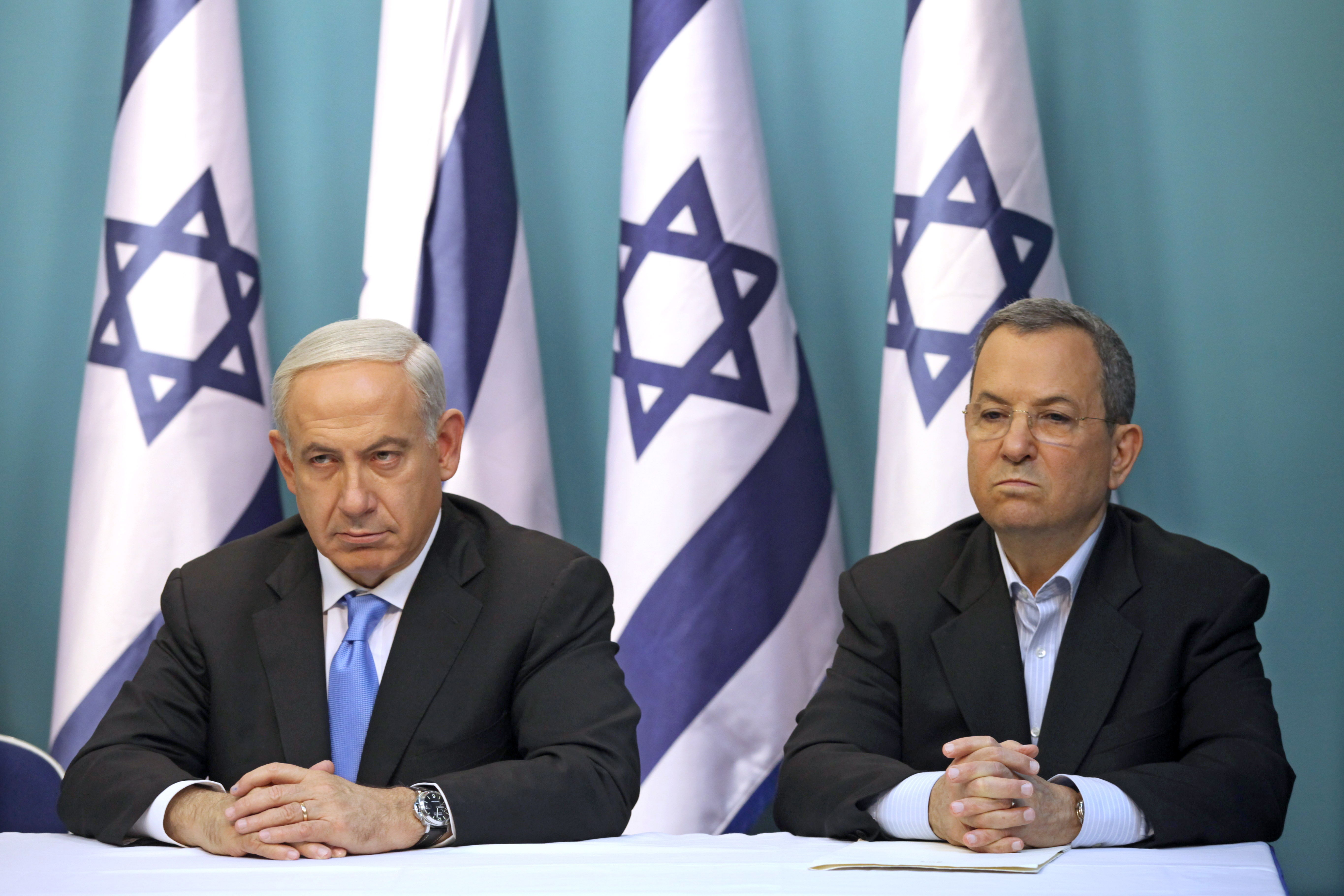 epa07676305 (FILE) - Israeli Prime Minister Benjamin Netanyahu (L) sits next to then Israeli Defense Minister Ehud Barak (R) during a press conference at the prime minister's office in Jerusalem, Israel, 21 November 2012 (reissued 27 June 2019). Former Israeli prime minister and defense minister Ehud Barak announced at a press conference on 26 June 2019 his intention to return to political life with a new party in order to challenge Netanyahu in the upcoming 17 September 2019 Israeli legislative election.  EPA/ABIR SULTAN