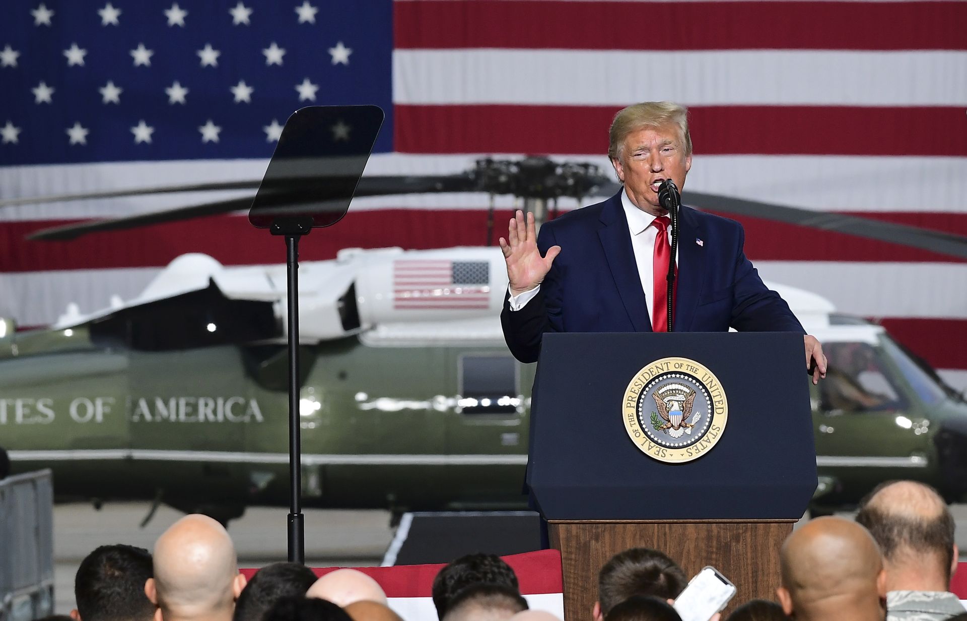 epa07684239 US President Donald J. Trump (C) speaks during a meeting with soldiers of the United States Forces in Korea (USFK) at the Osan Air Base in Pyeongtaek, Gyeonggi-do, South Korea, 30 June 2019.  The US leader arrived in South Korean on 29 June for a two-day visit that included a meeting with South Korean President Moon Jae-in and North Korean leader Kim Jong-un in the Demilitarized Zone that separates the two Koreas.  EPA/KIM MIN-HEE
