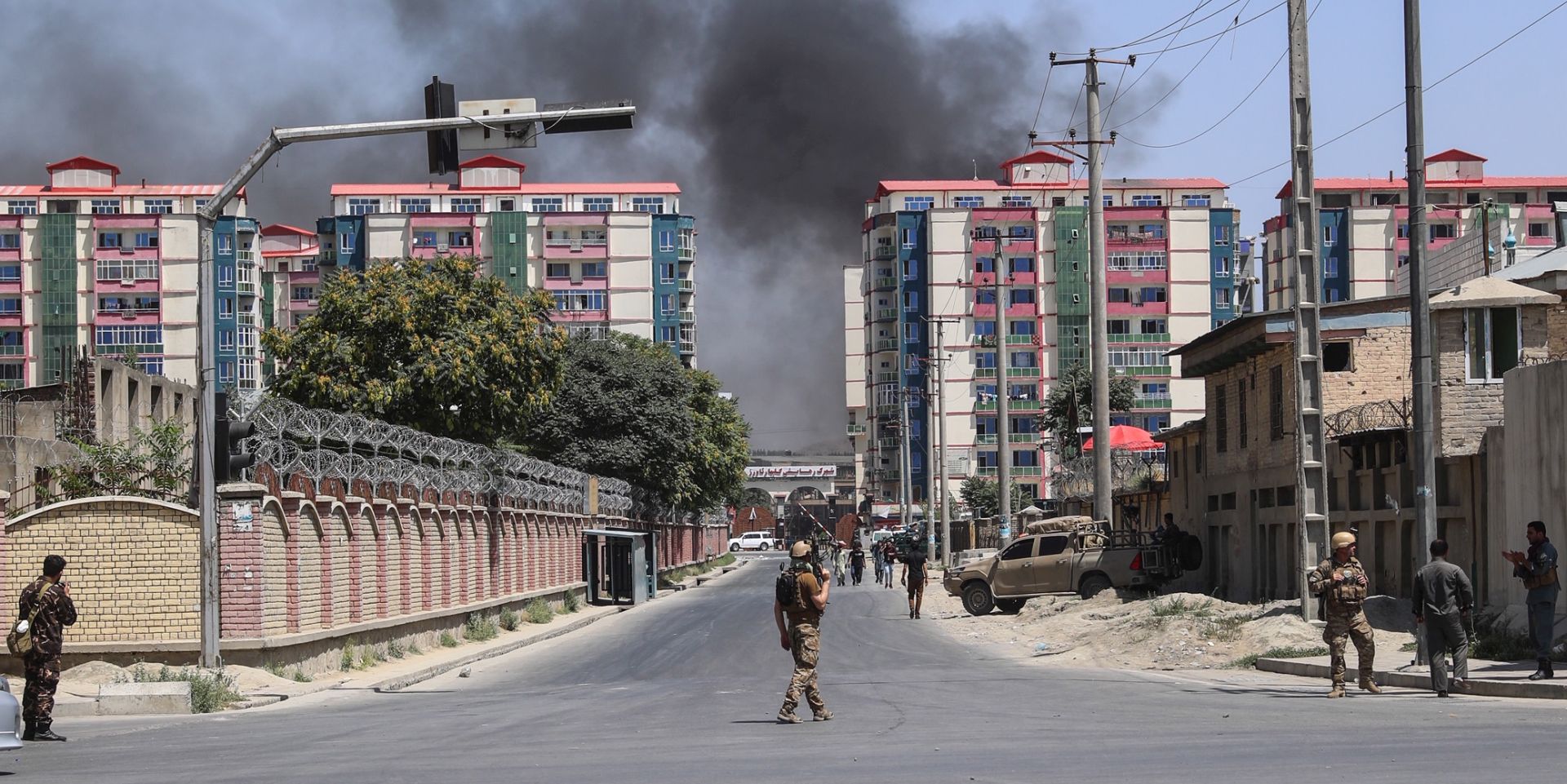 epa07686519 Afghan security officials secure the scene of a suicide bomb blast near a governmental institution in downtown Kabul, Afghanistan, 01 July 2019. According to reports, at least 10 people were killed and 65 others were injured after a bomb blast near the Ministry of Defense building.  EPA/HEDAYATULLAH AMID