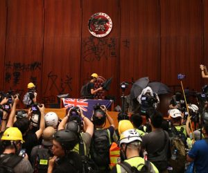 epa07687398 Protesters break into the main chamber of the Legislative Council building during the annual 01 July pro-democracy march in Hong Kong, China, 01 July 2019. Protesters are demanding the resignation of Hong Kong Chief Executive Carrie Lam and the full withdrawal of a suspended extradition bill. On 01 July, Hong Kong marks the 1997 transfer of sovereignty of Hong Kong from Britain to China.  EPA/JEROME FAVRE