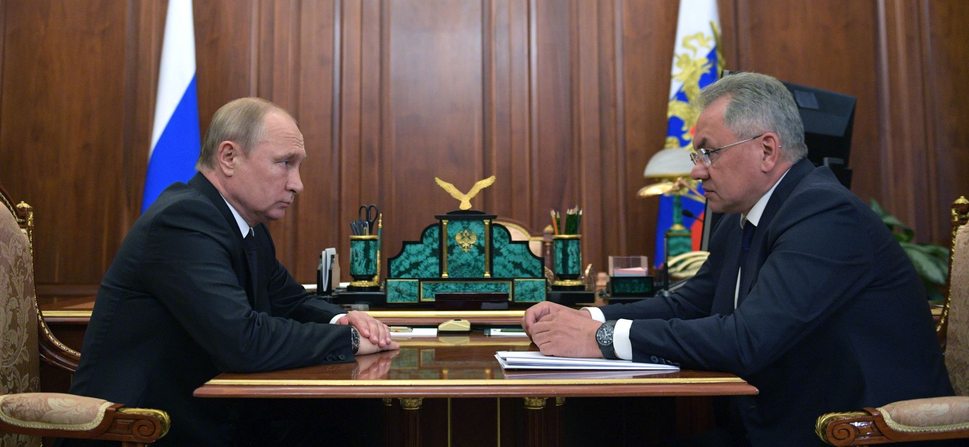 epa07690403 Russian president Vladimir Putin (L) listens to a report of Defence Minister Sergei Shoigu (R) about fire inside deepwater minisubmarine during their meeting at the Kremlin in Moscow, Russia, 02 July 2019. According to media reports citing the Russian Ministry of Defense, a fire incident inside a Russian submarine has left 14 people dead. The vessel is apparently part of the Northern Fleet, which is based in Severomorsk. The accident happened in the evening 01 July while the submarine worked on the bottom of Barents Sea in the Russian waters. There were two heroes of Russia among the crew of the submarine.  EPA/ALEXEI DRUZHININ / SPUTNIK / KREMLIN POOL MANDATORY CREDIT