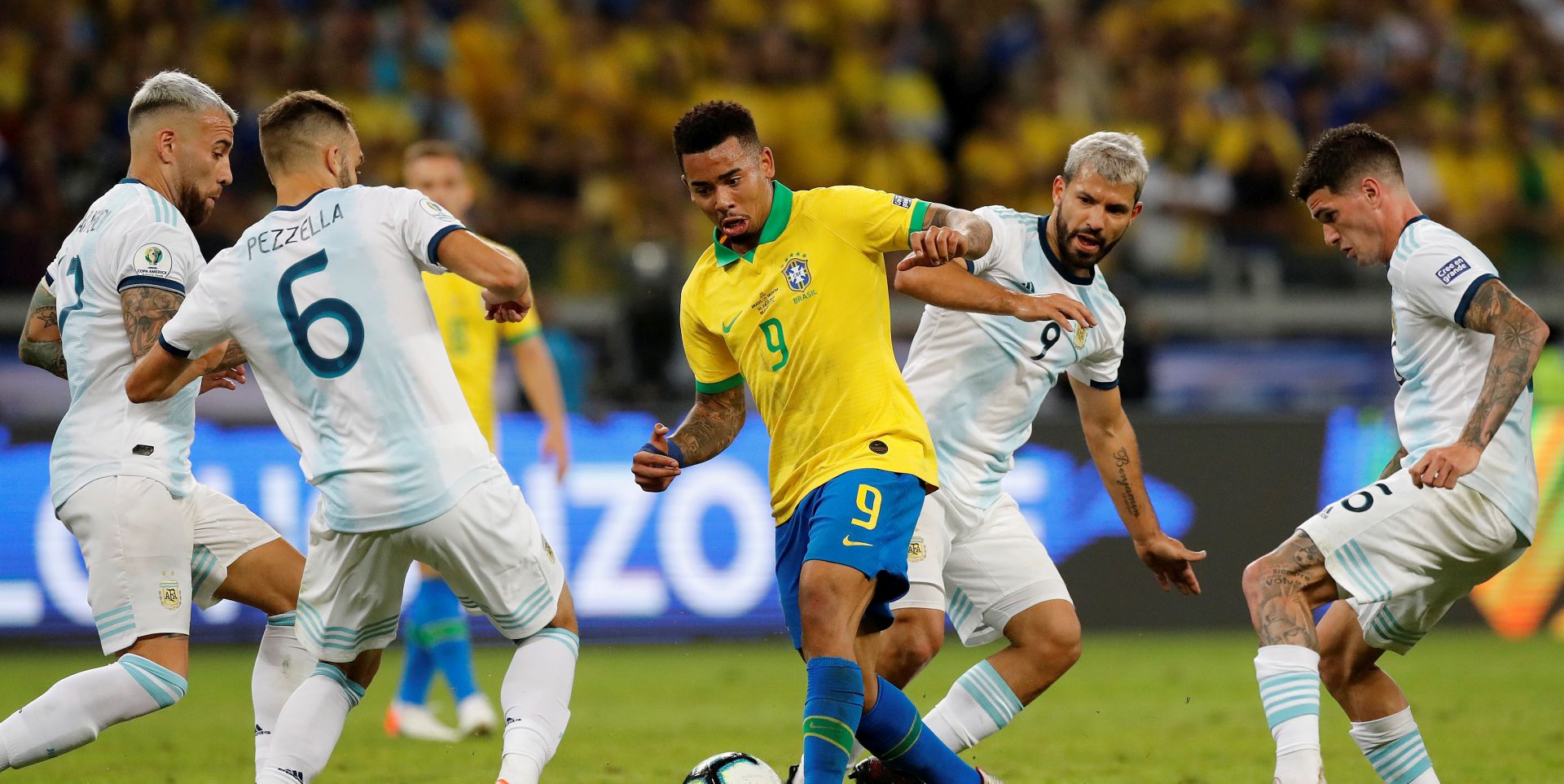 epa07690926 Brazil's Gabriel Jesus (C) in action against Argentina's players German Pezzella (2-L), Sergio Aguero (2-R) and Leandro Paredes (R) during the Copa America 2019 semi-finals soccer match between Brazil and Argentina at Mineirao Stadium in Belo Horizonte, Brazil, 02 July 2019.  EPA/Antonio Lacerda