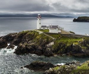 epa07699322 A picture take with a drone shows the 200-year-old Fanad Head Lighthouse on the northern coast of County Donegal, Ireland, 05 July 2019 (issued 06 July 2019). The lighthouse was built in 1817 following the shipwreck of the HMS Saldhana in nearby Lough Swilly, which caused all 253 passengers to lose their lives. Today, guests can overnight in the lighthouse, in quarters once used by lighthouse keepers.  EPA/JIM LO SCALZO
