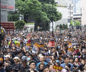 epa07700907 Anti-extradition bill protesters take part in a march to West Kowloon railway station in Hong Kong, China, 07 July 2019. The march aims to spread the spirit of resistance all over the land from Hong Kong Island to Kowloon, and even to Mainland China, according to the organizers.  EPA/CHAN LONG HEI