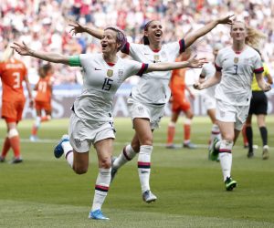 epa07701691 USA's Megan Rapinoe (L) celebrates after scoring  during the final match between USA and Netherlands at the FIFA Women's World Cup 2019 in Lyon, France, 07 July 2019.  EPA/IAN LANGSDON