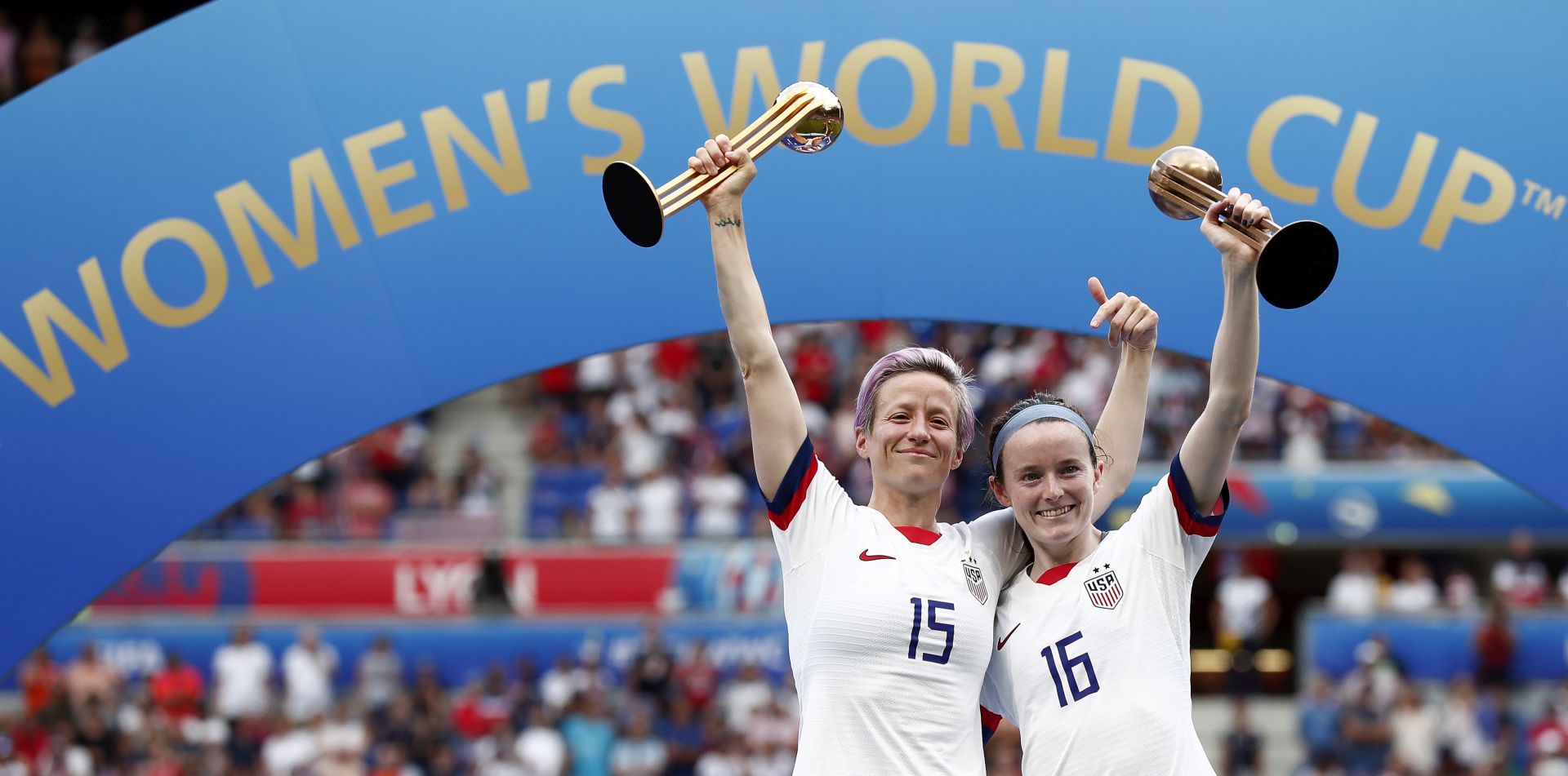 epa07701822 USA's Megan Rapinoe (L) and USA's Rose Lavelle (R) pose with the  trophy after the FIFA Women's World Cup 2019 final soccer match between USA and Netherlands in Lyon, France, 07 July 2019.  EPA/IAN LANGSDON