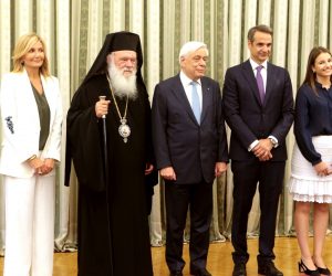 epa07703032 New Greek Prime Minister Kyriakos Mitsotakis (3-R) poses for a photo with Greek President Prokopis Pavlopoulos (C), Greek Archbishop Ieronymos II (3-L), Mitsotakis' wife Mareva Grabowski (2-L) and his children, Konstantinos (L), Dafni (R) and Sophia (2-R) after his swearing-in ceremony at the presidential palace in Athens, Greece, 08 July 2019. The center-right New Democracy party won general elections in Greece on 07 July and will form a majority government. A total of six parties will enter parliament based on the results. Voter participation reached 57.92 percent.  EPA/PANTELIS SAITAS