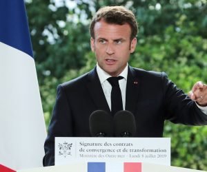 epa07703898 French President Emmanuel Macron (C) delivers a speech during a signing ceremony of Convergence and Transformation Contracts with Presidents of theOverseas collectivities  at the Overseas Ministery, in Paris, France, 08 July 2019. These Convergence and Transformation Contracts are the concrete expression of the ambitions set in the Overseas Blue Book which was presented on June 28, 2018 at the Elysee Palace on the basis of projects of the Assises des Outre-Mer conducted in the French territories.  EPA/CHRISTOPHE PETIT TESSON / POOL