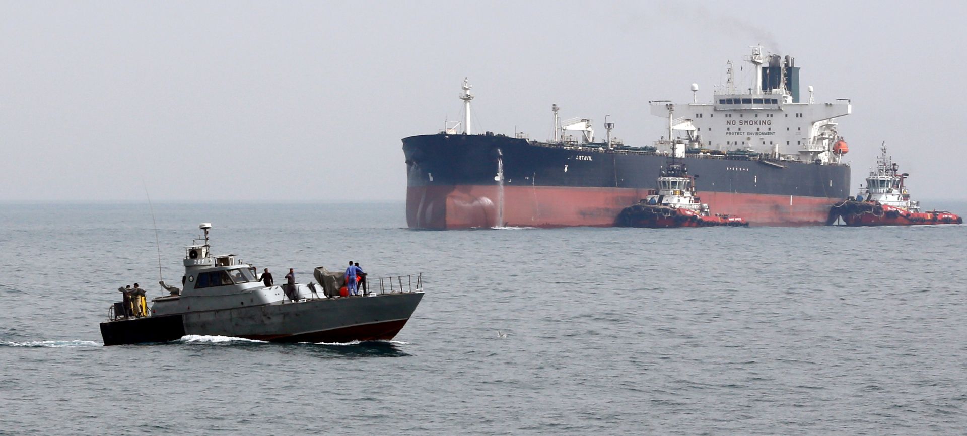 epa07709521 (FILE) - An Iranian military boat patrols next to the Artavil oil tanker, at the Kharg Island, in Persian Gulf, southern Iran, 12 March 2017 (reissued 11 July 2019). Reports on 11 July 2019 state British frigate HMS Montrose warned Iranian boats believed to belong to  Islamic Revolution Guard Corps (IRGC) of Iran that allegedly tried to impede the British Heritage tanker near the Gulf. HMS Montrose took position between the boats and the tanker while training its guns on the boats  reports state. The vessels then left the scene with no shots being fired on either side. Islamic Revolution Guard Corps (IRGC) has denied any involvement.  EPA/ABEDIN TAHERKENAREH