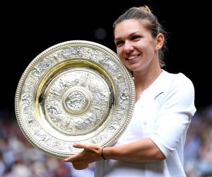 epa07714738 Simona Halep of Romania with the championship trophy as she celebrates her victory over Serena Williams of the US in the women's final of the Wimbledon Championships at the All England Lawn Tennis Club, in London, Britain, 13 July 2019. EPA/Laurence Griffiths / POOL EDITORIAL USE ONLY/NO COMMERCIAL SALES *** Local Caption *** LONDON, ENGLAND - JULY 13: during Day twelve of The Championships - Wimbledon 2019 at All England Lawn Tennis and Croquet Club on July 13, 2019 in London, England. (Photo by Laurence Griffiths/Getty Images)