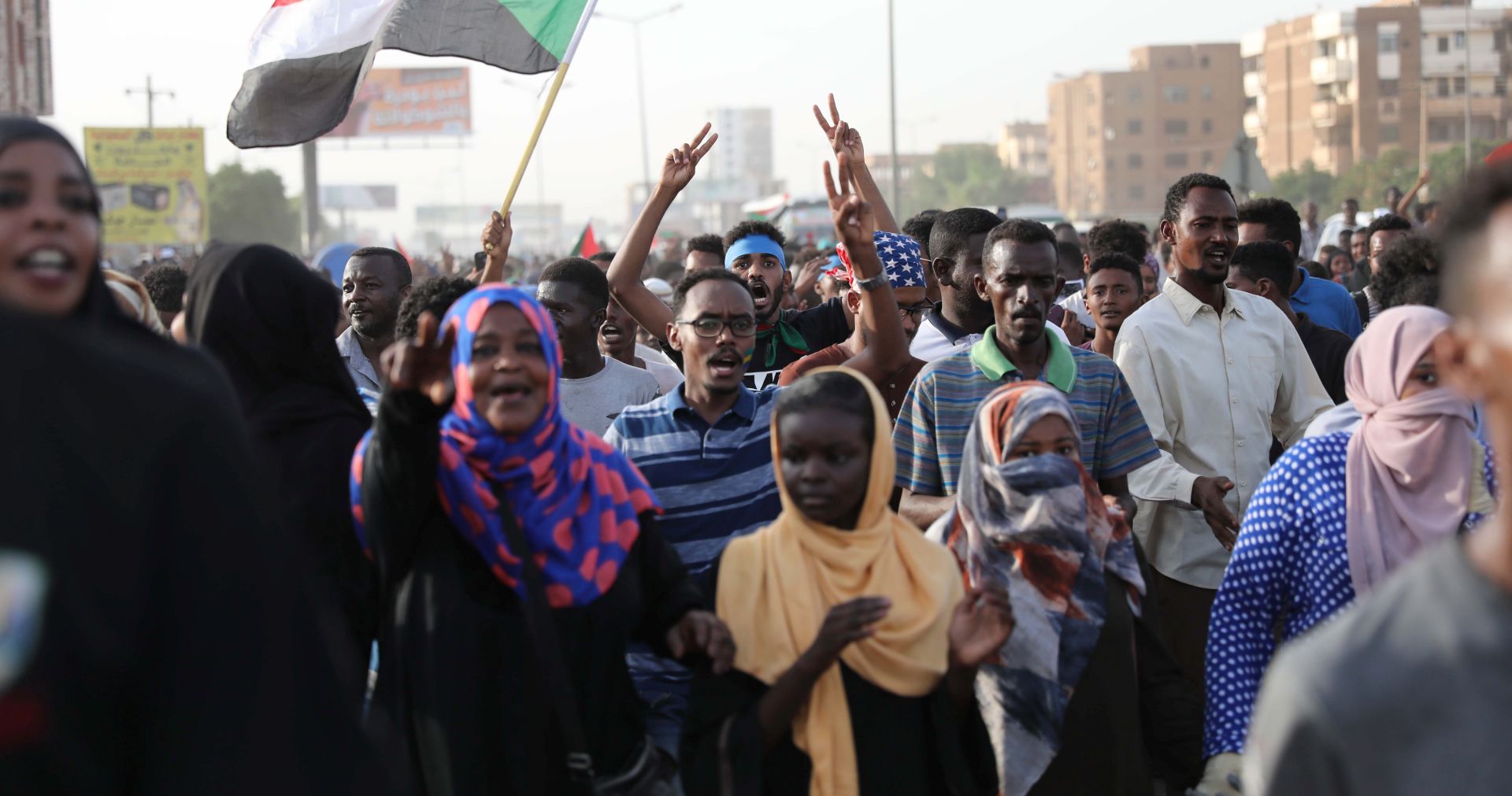 epa07715027 Sudanese people march to mark the 40th Day after death of protesters killed during the sit-in outside army headquarters in Khartoum, Sudan, 13 July 2019. Scores of protesters were killed in a raid on the sit-in camp outside the army headquarters in Khartoum on 03 June. Hundreds of protesters marched on 13 July calling for justice and fair investigation in the killings that left a number of victims ranging between 128 people according to civil groups and 61 according to official figures.  EPA/MARWAN ALI