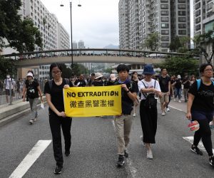 epa07715889 Anti-extradition bill protesters hold a banner 'No Extradition' as they march during a rally in Shatin, Hong Kong, China, 14 July 2019. Spurred by the momentum of the anti-extradition movement, the protesters are demanding the complete withdrawal of the extradition bill, which would have allowed the transfer of fugitives to mainland China, and unconditional release of all arrested protesters among other demands.  EPA/JEROME FAVRE