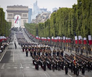 epa07716192 A general view of troops marching during the annual Bastille Day military parade on the Champs Elysees avenue in Paris, France, 14 July 2019. Bastille Day, the French National Day, is held annually on 14 July to commemorate the storming of the Bastille fortress in 1789.  EPA/IAN LANGSDON