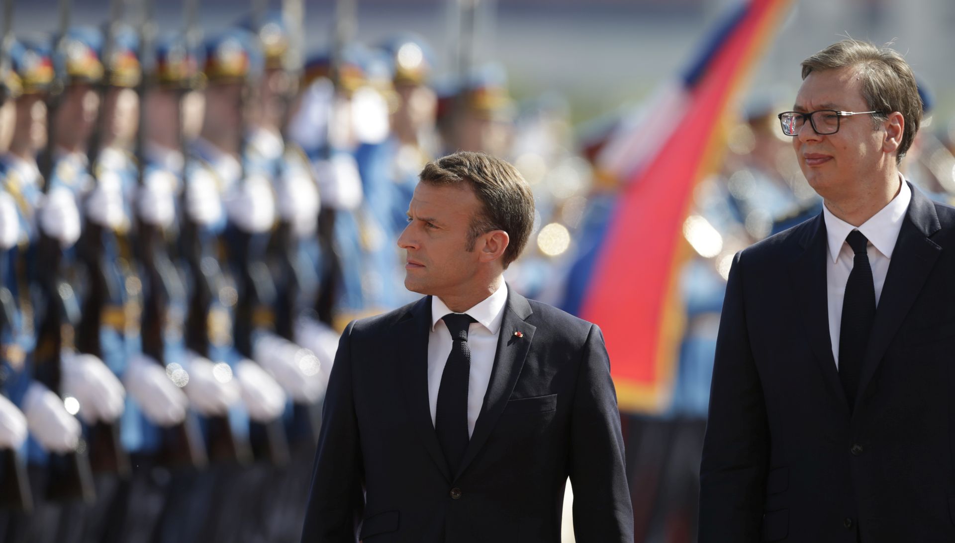 epa07718851 French President Emmanuel Macron (L) inspects the guard of honour with Serbian President Aleksandar Vucic (R) in Belgrade, Serbia, 15 July 2019. President Macron is on a two-day state visit to Serbia.  EPA/ANDREJ CUKIC