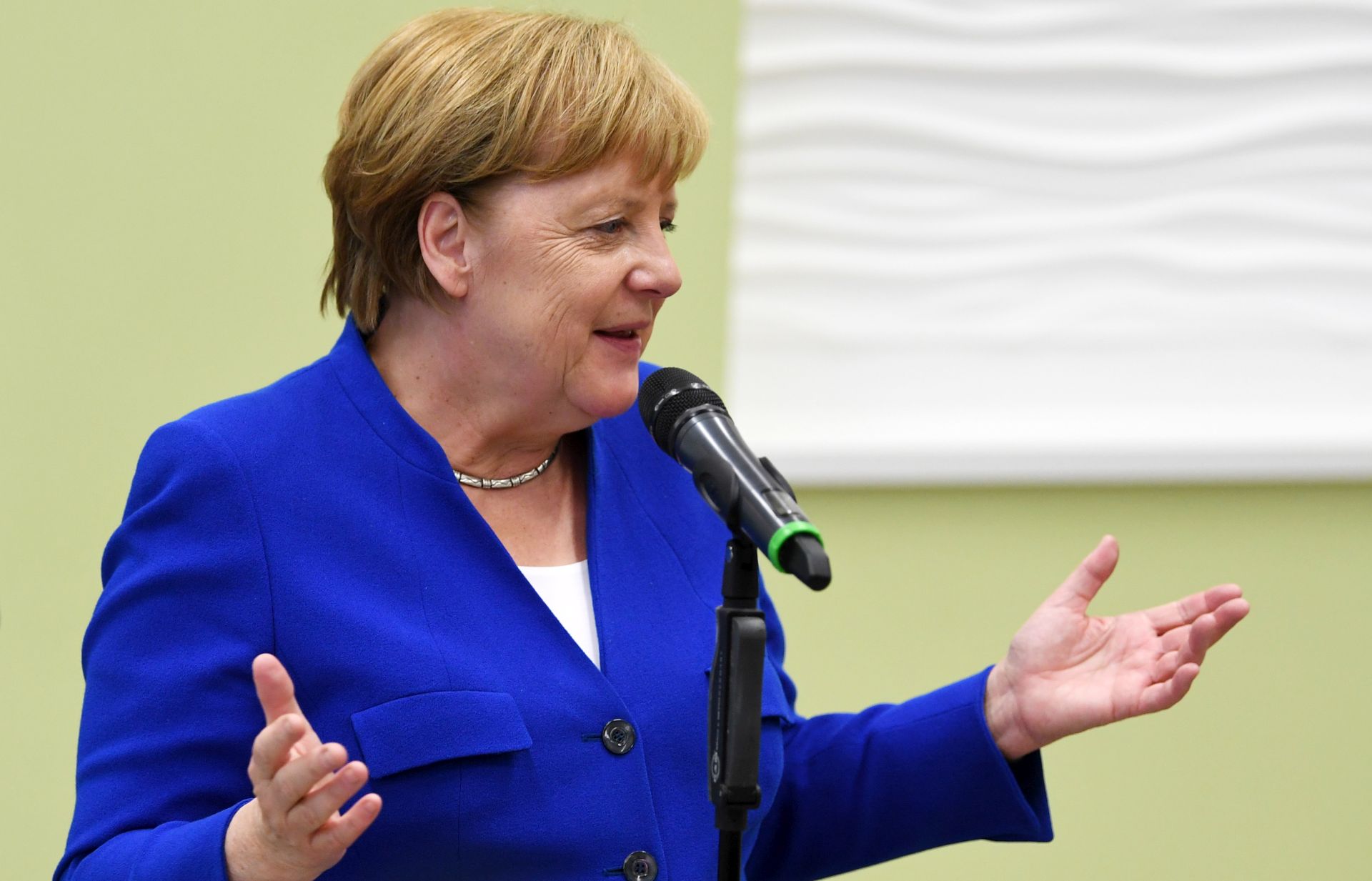 epa07719118 German Chancellor Angela Merkel gives a statement after her visit to the Siemens plant in Goerlitz, Germany, 15 July 2019.  EPA/FILIP SINGER