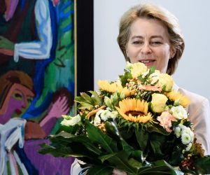 epa07721732 Outgoing German Defense Minister and newly elected European Commission President Ursula von der Leyen holds flowers she received from German Chancellor Angela Merkel (not in the picture) during the beginning of the weekly meeting of the German Federal cabinet at the Chancellery in Berlin, Germany, 17 July 2019. During the 61st  cabinet meeting, the Chancellor and the ministers are expected to discuss amongst other topics a draft law for the protection of measles and the enforcement of the vaccination program.  EPA/CLEMENS BILAN