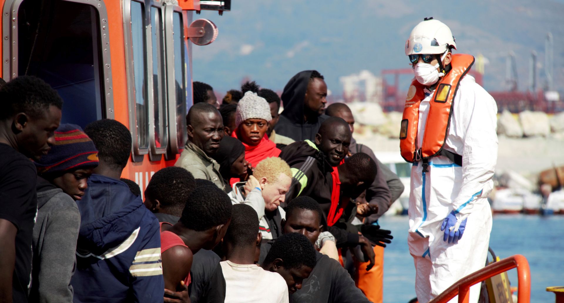 epa07725551 Some of 124 migrants arrive at the Granada port in Motril, Granada, Spain, 18 July 2019. Maritime Rescue rescued 124 migrants, including twenty women and four children, when they were sailing in the waters of the Alboran Sea.  EPA/Alba Feixas