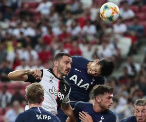 epa07731257 Tottenham's Son Heung-min (R) in action against Juventus' Leonardo Bonucci (L) during the International Champions Cup (ICC) soccer match between Juventus FC and Tottenham Hotspur at the National Stadium in Singapore, 21 July 2019.  EPA/WALLACE WOON