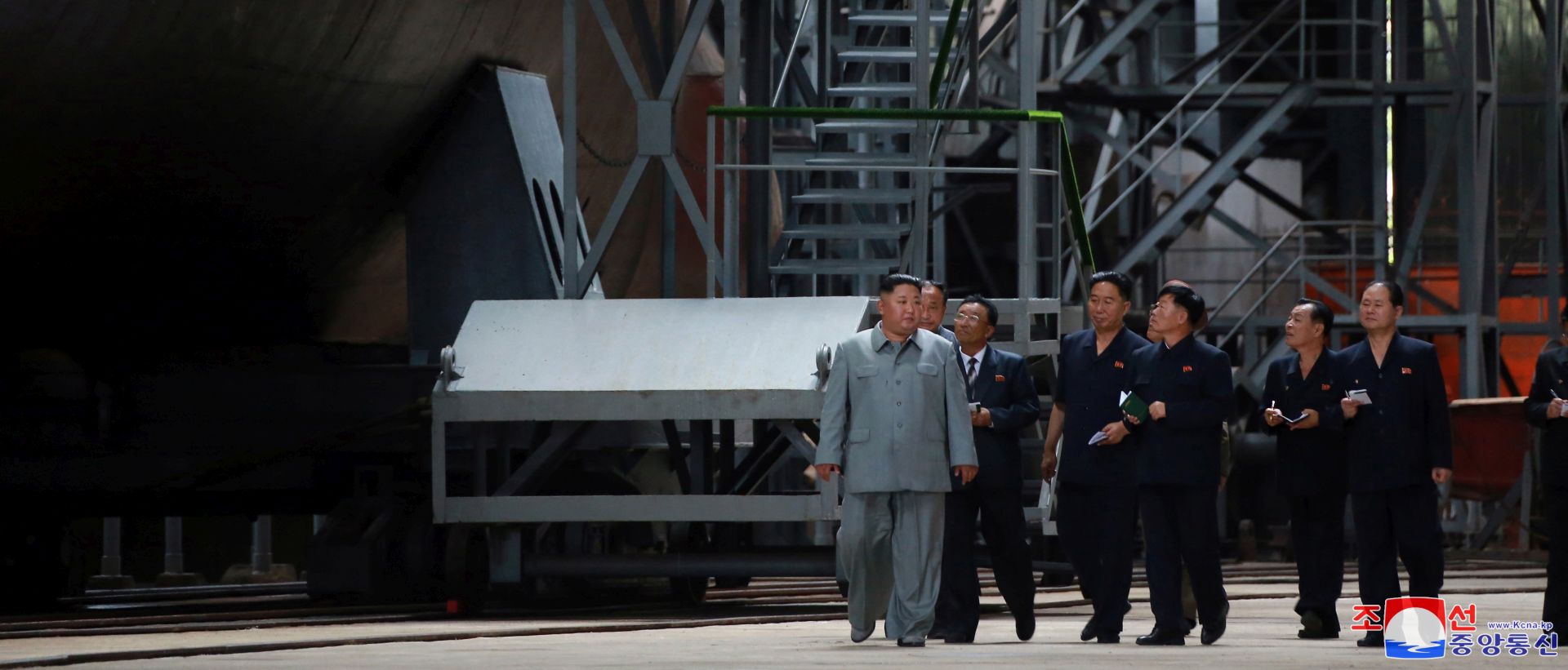 epa07734365 A photo released by the official North Korean Central News Agency (KCNA) on 23 July 2019 shows Kim Jong-Un (C), chairman of the Workers' Party of Korea, chairman of the State Affairs Commission of the Democratic People's Republic of Korea, and supreme commander of the armed forces of the DPRK, made a round of the newly-laid down submarine at an undisclosed location in North Korea.  EPA/KCNA   EDITORIAL USE ONLY