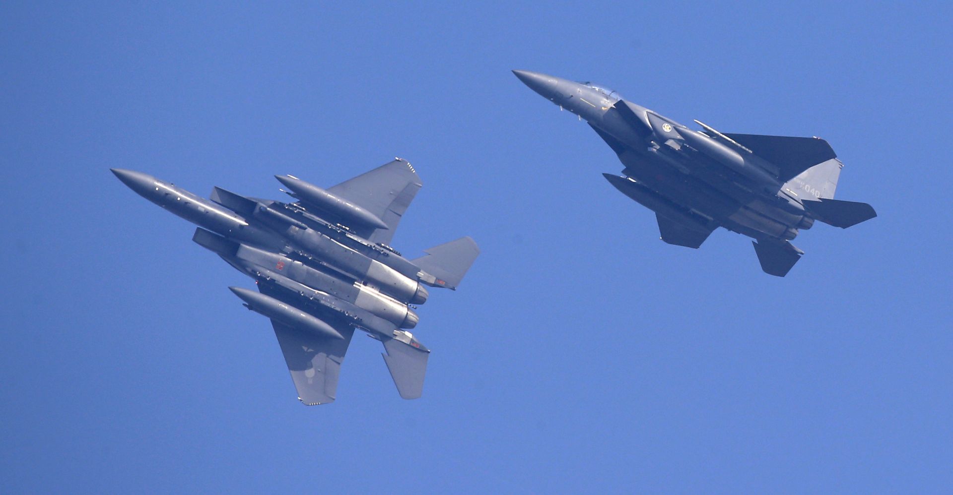 epa07734414 (FILE) - F-15K fighter jets from South Korea's airforce fly above the Osan Air Base during the Invincible Shield exercise, in Pyeongtaek, south of Seoul, South Korea, 08 November 2016 (reissued 23 July 2019). According to media reports on 23 July 2019, a Russian military plane violated South Korean airspace, prompting South Korean milirary officials to fire a warning shot and deploy F-15K and F-16K fighter jets to intercept the plane. The incident occured near the Dokdo islets.  EPA/JEON HEON-KYUN