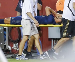 epa07736793 Real Madrid midfielder Marco Asensio is carried from the pitch after an injury against the Arsenal during the second half of the International Champions Cup (ICC) soccer match between Real Madrid and Arsenal at FedEx Field in Landover, Maryland, USA, 23 July 2019.  EPA/ERIK S. LESSER