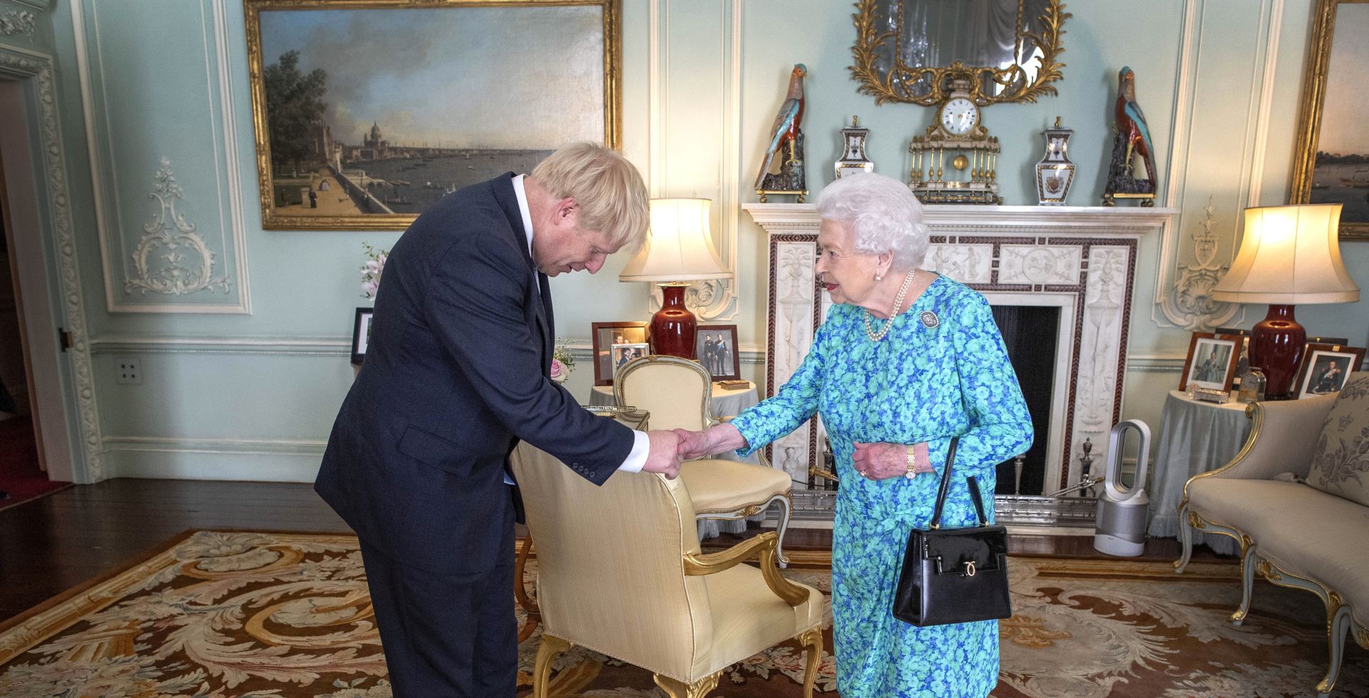 epa07737747 Britain's Queen Elizabeth II welcomes newly elected leader of the Conservative party Boris Johnson during an audience in Buckingham Palace, London, Britain, 24 July 2019 where she invited him to become Prime Minister and form a new government. Former London mayor and foreign secretary Boris Johnson is taking over the post after his election as party leader was announced the previous day. Theresa May stepped down as British Prime Minister following her resignation as Conservative Party leader on 07 June.  EPA/VICTORIA JONES / POOL