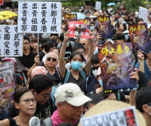 epa07745464 Anti-extradition bill protesters take part in a rally against the police brutality in Hong Kong, China, 28 July 2019. Hong Kong has a new mass rally with demonstrators protesting against the police brutality on 27 July in Yuen Long, another mass protest was held and ended up with clashes between protesters and the police when riot police fired rubber bullets, tear gas and pepper spray to disperse the crowd.  EPA/RITCHIE B. TONGO