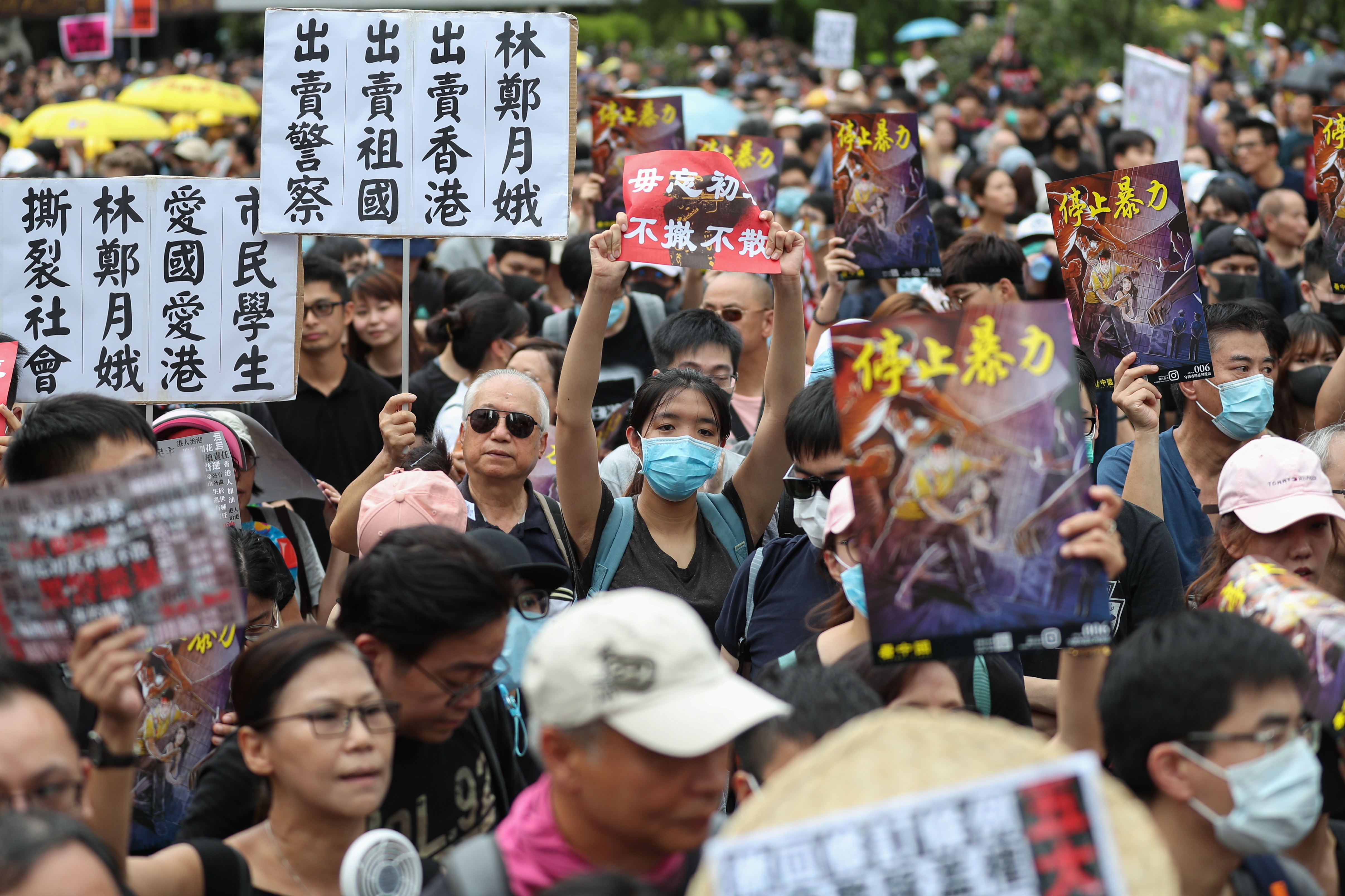 epa07745464 Anti-extradition bill protesters take part in a rally against the police brutality in Hong Kong, China, 28 July 2019. Hong Kong has a new mass rally with demonstrators protesting against the police brutality on 27 July in Yuen Long, another mass protest was held and ended up with clashes between protesters and the police when riot police fired rubber bullets, tear gas and pepper spray to disperse the crowd.  EPA/RITCHIE B. TONGO