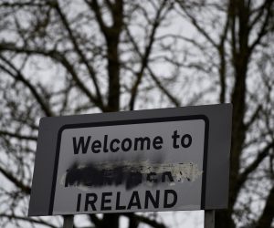 FILE PHOTO: Criss-crossing Irish border, Brexit threatens status quo FILE PHOTO: A defaced 'Welcome to Northern Ireland' sign stands on the border in Middletown, Northern Ireland, December 9, 2017. REUTERS/Clodagh Kilcoyne/File Photo Clodagh Kilcoyne