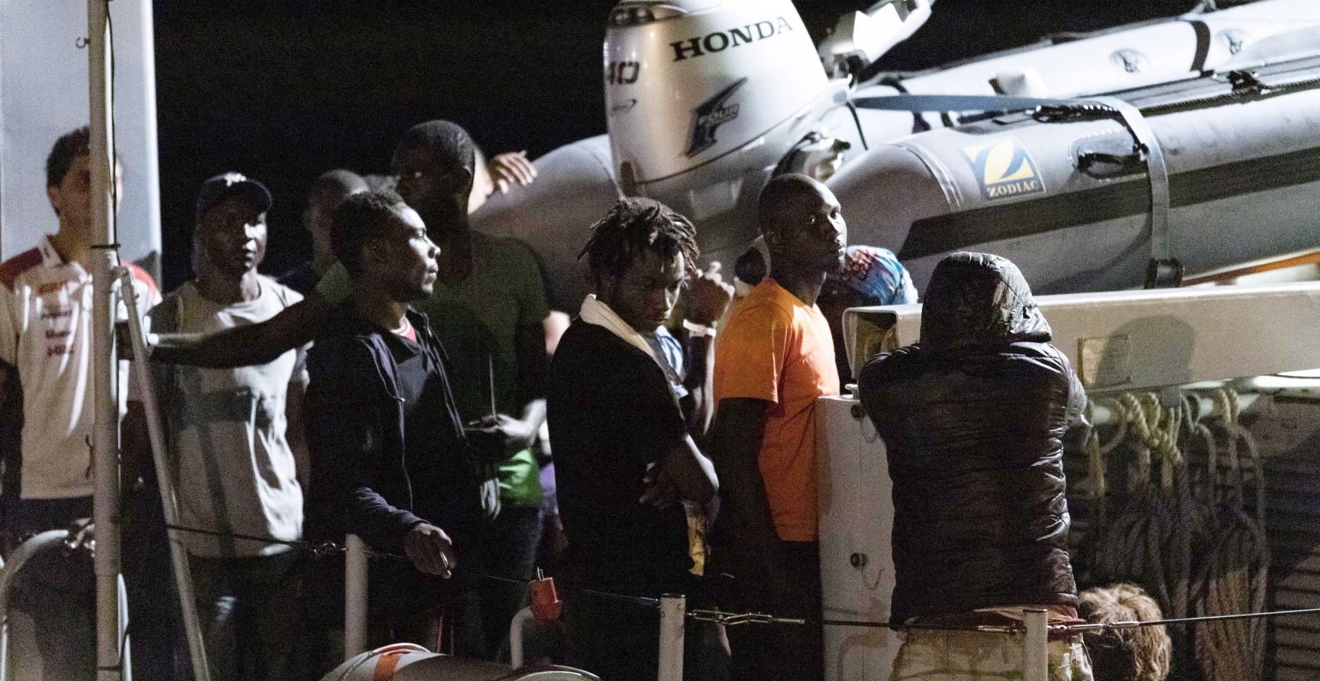 epa07704696 Migrants disembark from an Italian Guardia di Finanza (GdF) ship in Pozzallo, Sicily Island, southern Italy, 09 July 2019.  A total of 53 migrants were rescued on a boat in the Sicilian Channel by a Coast Guard patrol boat, but six of them were immediately transferred to Lampedusa due to medical problems.  EPA/FRANCESCO RUTA