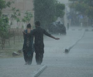 epa07719058 A couple walks amid monsoon rain, in New Delhi, India, 15 July 2019. According to media reports, More than three million people have been affected by floods and displaced across eastern India amid heavy rains, triggered landslides and flooding that has cost lives and destroyed homes  EPA/STR