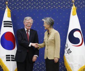 epa07736496 US National Security Adviser John Bolton (L) shakes hands with South Korean Foreign Minister Kang Kyung-wha (R) during their meeting at the foreign ministry building in Seoul, South Korea, 24 July 2019. John Bolton arrived in South Korea on a two-day visit to discuss ways to strengthen the South Korea-US alliance and resolve the situation on the Korean Peninsula.  EPA/KIM HEE-CHUL / POOL