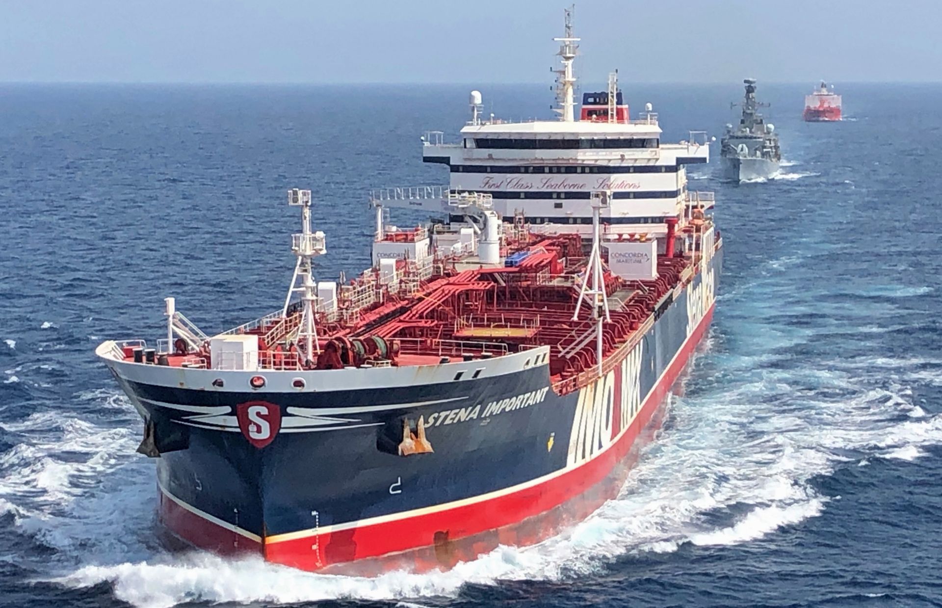 epa07740308 A handout picture provided by the British Ministry of Defence (MOD) shows the Stena Important being accompanied by the British Navy frigate HMS Montrose and the Sea Ploeg vessel through the Strait of Hormuz between the Persian Gulf and the Gulf of Oman, 25 July 2019. The Royal Navy has started providing escort for British-flagged ships passing through the Strait of Hormuz  following Iran's seizure of British-flagged tanker Stena Impero.  EPA/MOD/BRITISH MINISTRY OF DEFENCE/HANDOUT MANDATORY CREDIT: MOD/CROWN COPYRIGHT HANDOUT EDITORIAL USE ONLY/NO SALES