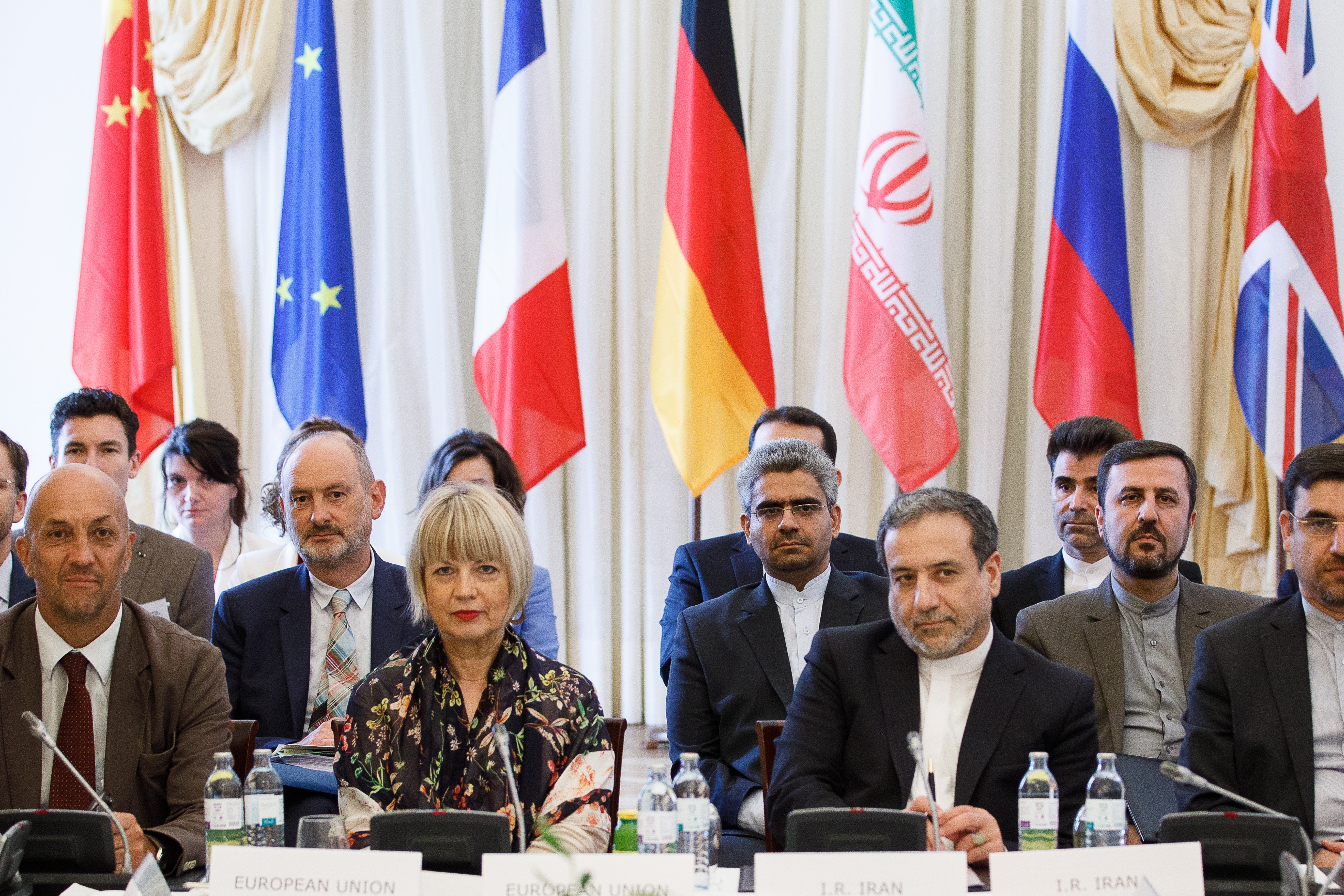 epa07745544 EU director Helga Schmid (L) and Iranian Deputy-Foreign Ministers Abbas Araghchi (R) attend an extraordinary JCPOA Joint Commission meeting at the Palais Coburg, in Vienna, Austria, 28 July 2019. The JCPOA Joint Commission meeting at a Political Directors' level is chaired on behalf of European Union High Representative Federica Mogherini by European External Action Service (EEAS) Secretary General Helga Maria Schmid and is attended by E3/EU+2 (Germany, France, the United Kingdom, China, Russia) and Iran.  EPA/FLORIAN WIESER