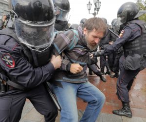 epa07754983 Russian riot police fight with resisting detained participant of liberal opposition protest action in the center of Moscow, Russia, 03 August 2019. Liberal opposition called their supporters to continue their protest actions against rejecting their candidates for Moscow City Duma elections, which is scheuled for 08 September. Most of the candidates have been placed on administrative arrest before and during last week protest action where  about 1,300 participants were detained.  EPA/MAXIM SHIPENKOV
