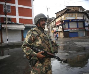 epa07762144 An Indian paramilitary soldier stands guard near a temporary barricade during restriction in Srinagar, India, 08 August 2019. Indian Home Minister Amit Shah on 05 August moved a resolution in the parliament that repeals Article 370 and remove the special constitutional status granted to the disputed Kashmir region. Since the announcement, the Indian-administered Kashmir region is under heavy lockdown with a restriction on public gatherings. Leaders in the region were also put under house arrest.  EPA/FAROOQ KHAN