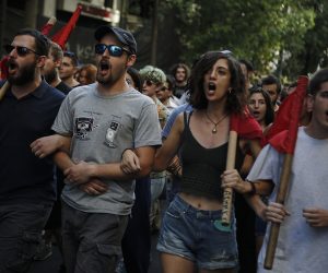epa07762522 University students shout slogans as they take part in a rally against the abolition of the university asylum, in central Athens, Greece, 08 August 2019. Greek lawmakers has repealed regulations that make universities a no-go zone for the police, a move the the authorities say will fight lawlessness but that critics describe as a blow on democracy.  EPA/YANNIS KOLESIDIS