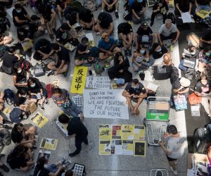 epa07763522 Protesters rally inside the arrivals hall of Hong Kong International Airport in Hong Kong, China, 09 August 2019. Protesters were gathering at the airport for a three-day sit-in to protest against a now-suspended extradition bill and call for universal suffrage, and to raise awareness among international visitors to Hong Kong of claims of police brutality.  EPA/JEROME FAVRE