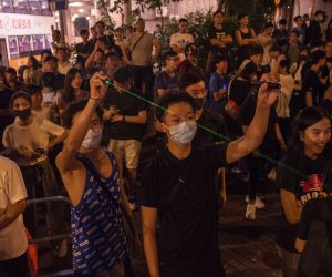 epa07764488 Residents and anti-government protesters use laser pointers during a rally in Wong Tai Sin, Hong Kong, China, 09 August 2019. Hong Kong has been gripped for weeks by mass protests, which began in June 2019 over a now-suspended extradition bill to China and have developed into an anti-government movement.  EPA/MIGUEL CANDELA