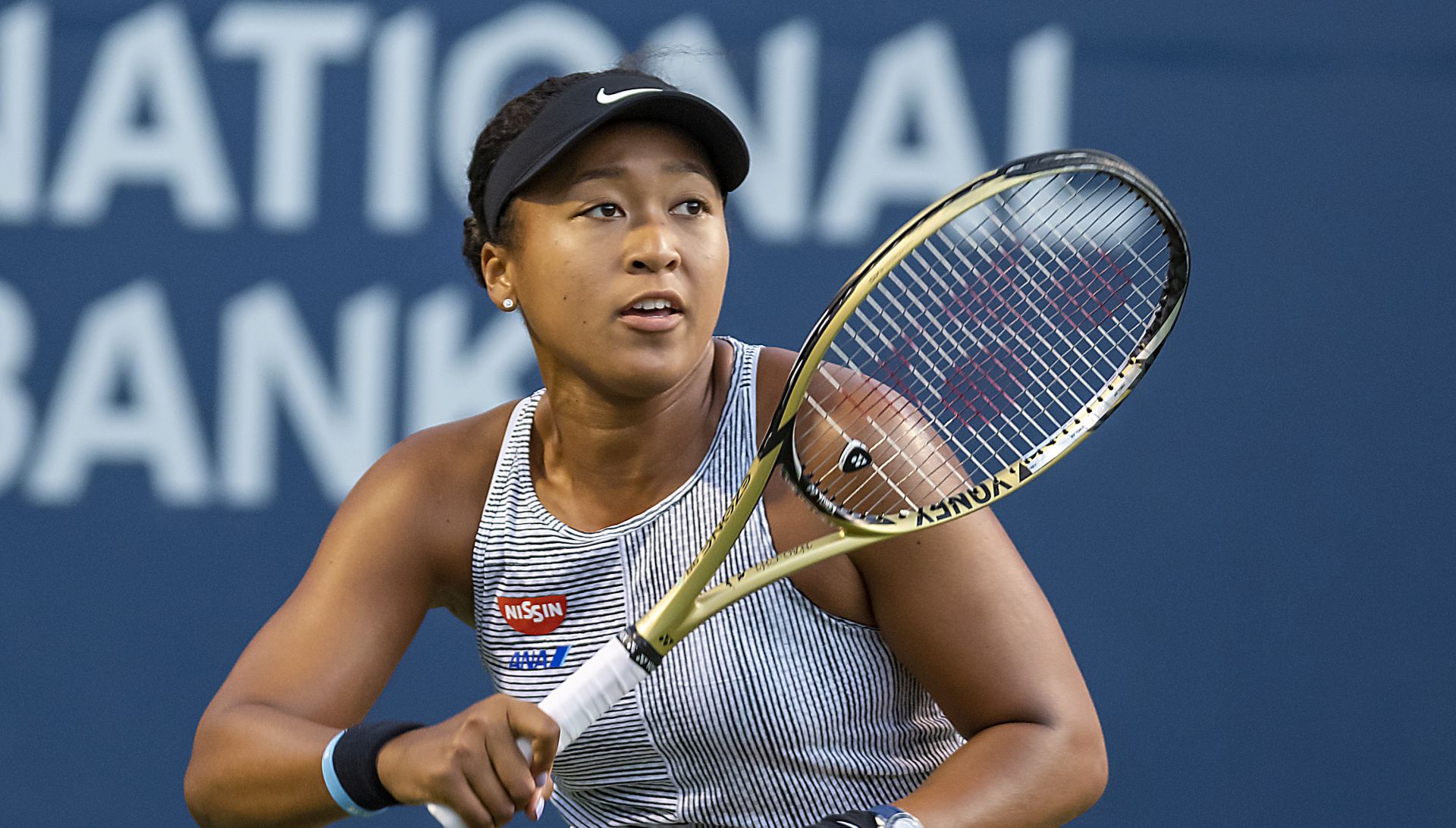 epa07765214 Naomi Osaka of Japan in action against Serena Williams of the USA during their quarterfinals match at the Rogers Cup tennis tournament in Toronto, Canada, 09 August 2019.  EPA/WARREN TODA