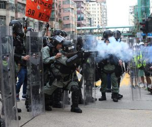 epa07767829 Riot police fire tear gas at anti-government protesters during a rally in Sham Shui Po, Hong Kong, China, 11 August 2019. Hong Kong has been gripped for weeks by mass protests, which began in June 2019 over a now-suspended extradition bill to China and have developed into an anti-government movement.  EPA/JEROME FAVRE