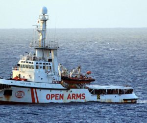 epa07774325 A view of Spanish humanitarian ship Open Arms, with 147 migrants on board, in the immediate vicinity of Lampedusa, southern Italy, 15 August 2019. Several patrol boats of the Italian finance guard and the harbor master's office are monitoring the movements of the Spanish NGO boat that headed towards the island of Pelagie, escorted by two military ships, after the Lazio Regional Administrative Court accepted its appeal, suspending the ban on entry into Italian waters ordered by Italian Interior Minister Matteo Salvini.  EPA/ELIO DESIDERIO