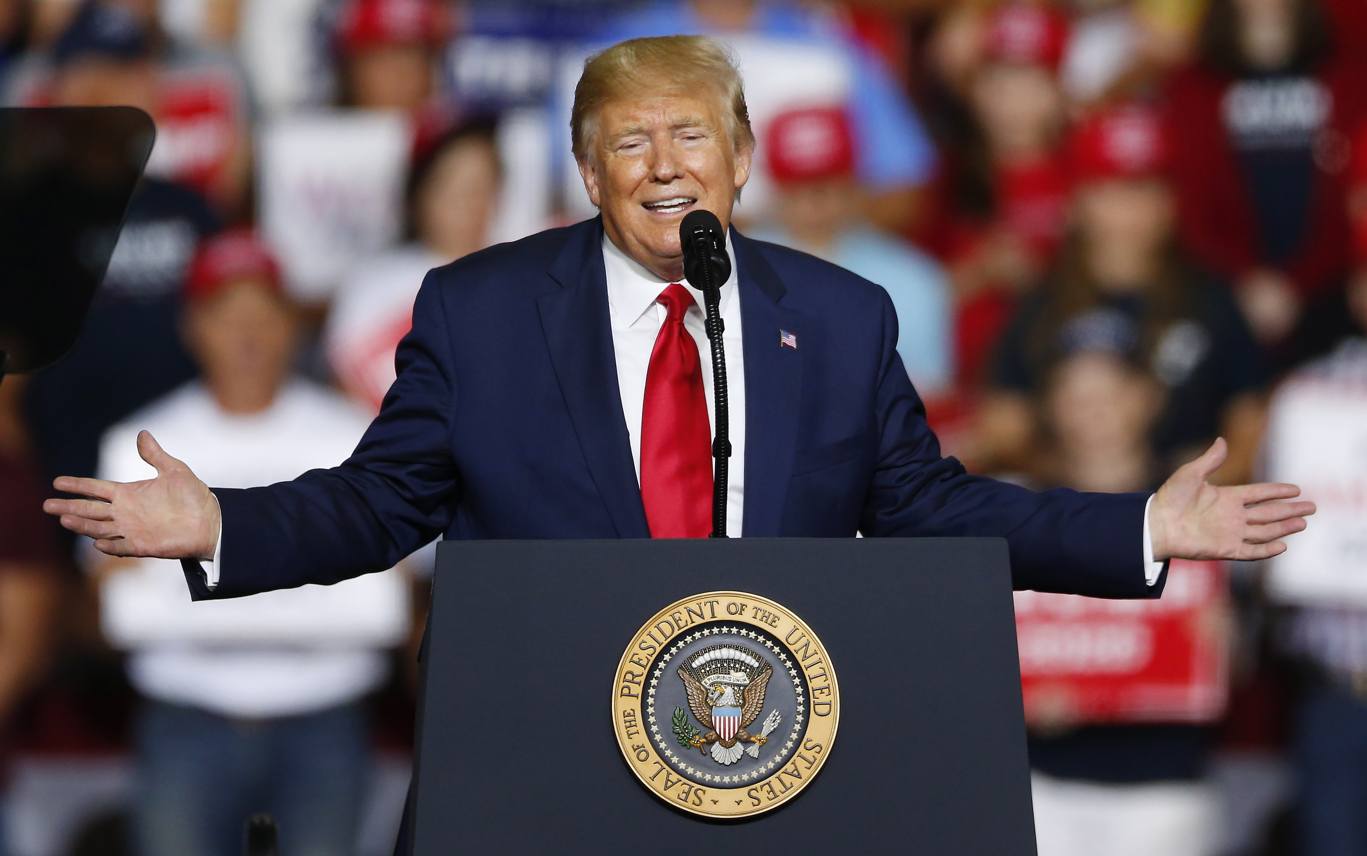 epa07775679 United States President Donald J. Trump speaks during a rally inside the Southern New Hampshire University Arena in Manchester, New Hampshire, USA 15 August 2019. The Nation's first Presidential Primary will take place in New Hampshire in 180 days on 11 February 2020.  EPA/CJ GUNTHER