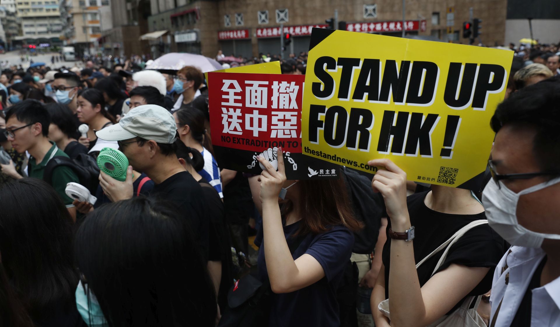 epa07777183 Protesters hold up placards as they take part in a march themed 'Recover Hung Hom' in To Kwa Wan, Hong Kong, China, 17 August 2019. Hung Hom and To Kwa Wan are popular areas for low-cost travel tours from mainland China. The city braced itself for another weekend of protests demanding the full withdrawal of a now-suspended extradition bill as well as the appointment of a judge-led independent inquiry into police use of force on protesters since June.  EPA/ROMAN PILIPEY