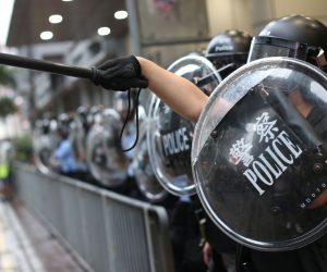 epa07777359 Riot police stand guard as anti-government protesters gather outside the Mong Kok Police station after a march themed 'Recover Hung Hom' in Mong Kok, Hong Kong, China, 17 August 2019. Hung Hom and To Kwa Wan are popular areas for low-cost travel tours from mainland China. The city braced itself for another weekend of protests demanding the full withdrawal of a now-suspended extradition bill as well as the appointment of a judge-led independent inquiry into police use of force on protesters since June.  EPA/JEROME FAVRE