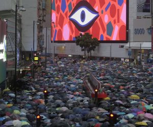 epa07778978 Protesters holding umbrellas amid heavy rain march in an anti-government rally in Causeway Bay, Hong Kong, China, 18 August 2019. Hong Kong braced itself for another weekend of protests demanding the full withdrawal of a now-suspended extradition bill as well as the appointment of a judge-led independent inquiry into police use of force on protesters since June.  EPA/VIVEK PRAKASH